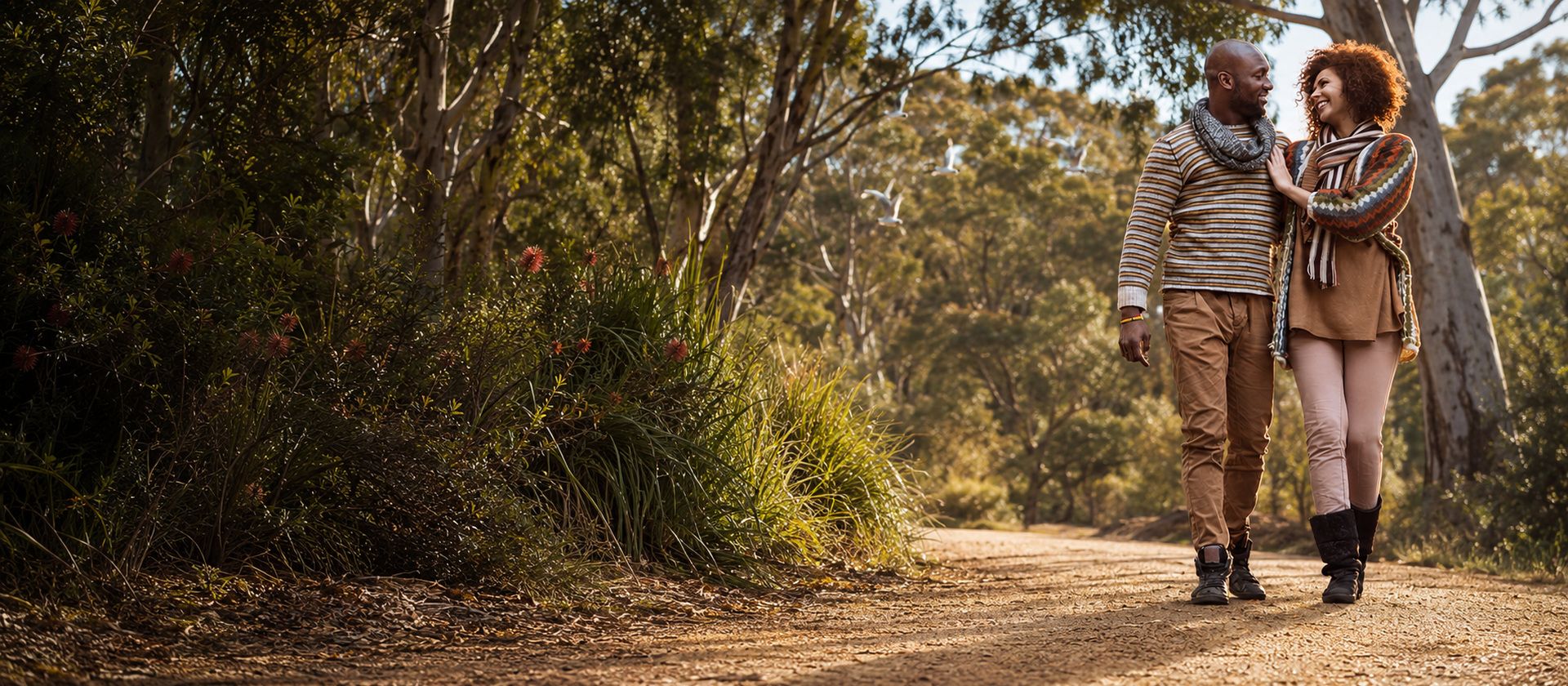 A couple walking together along a bushland path